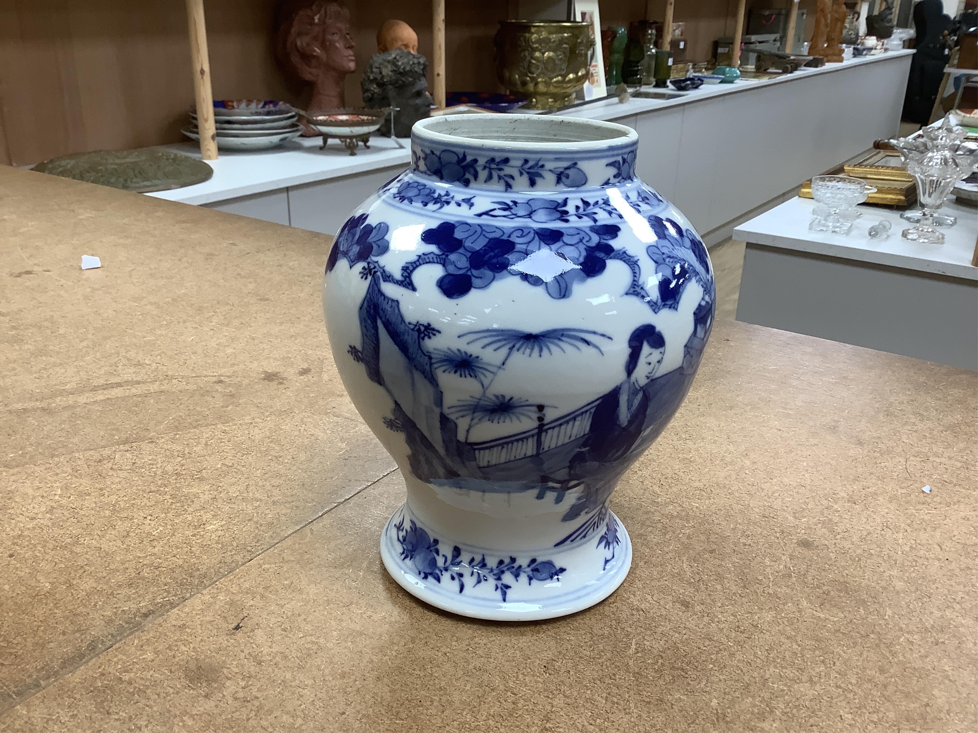 An early 20th century Chinese blue and white porcelain vase and cover decorated with figures in a landscape and a Japanese circular bowl, tallest 23cm. Condition - good